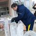 William Collins, of Ann Arbor, carves one of three ice block sculptures outside of the Kellogg Eye Center on Thursday, Feb. 14. Collins etched one of the carvings with the message "Will U Marry Me?" and planned to surprise his girlfriend Beth Ryan with a proposal.  Melanie Maxwell I AnnArbor.com